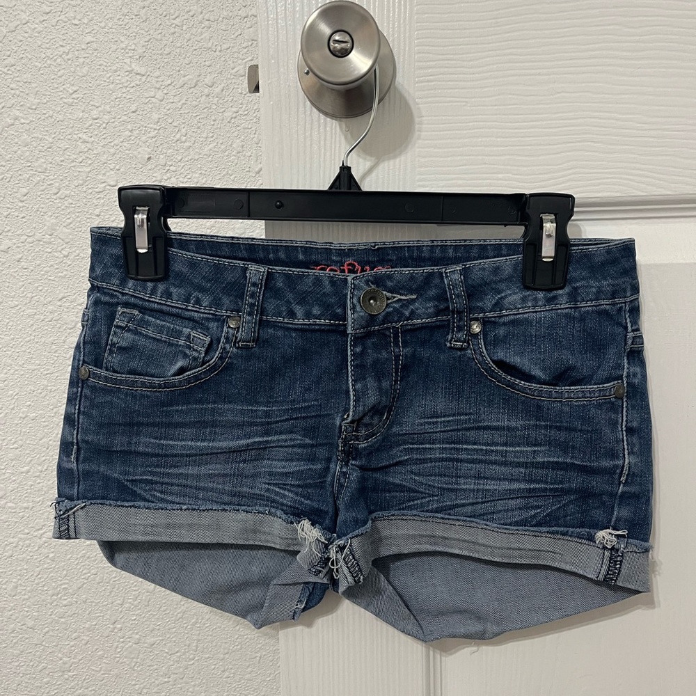 Selling refuge shorts, a size 2 with distressing on the cuff at the bottom.